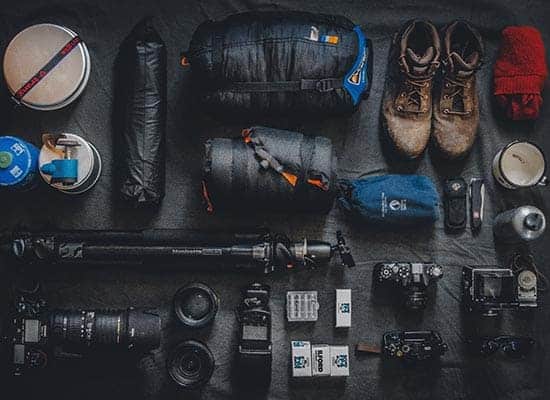 gear and hiking resources laid out to prepare for a hiking trip