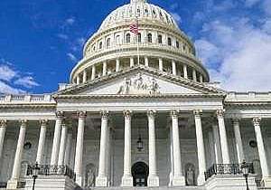 United States Capitol Building. White pillar building with large dome overhead.